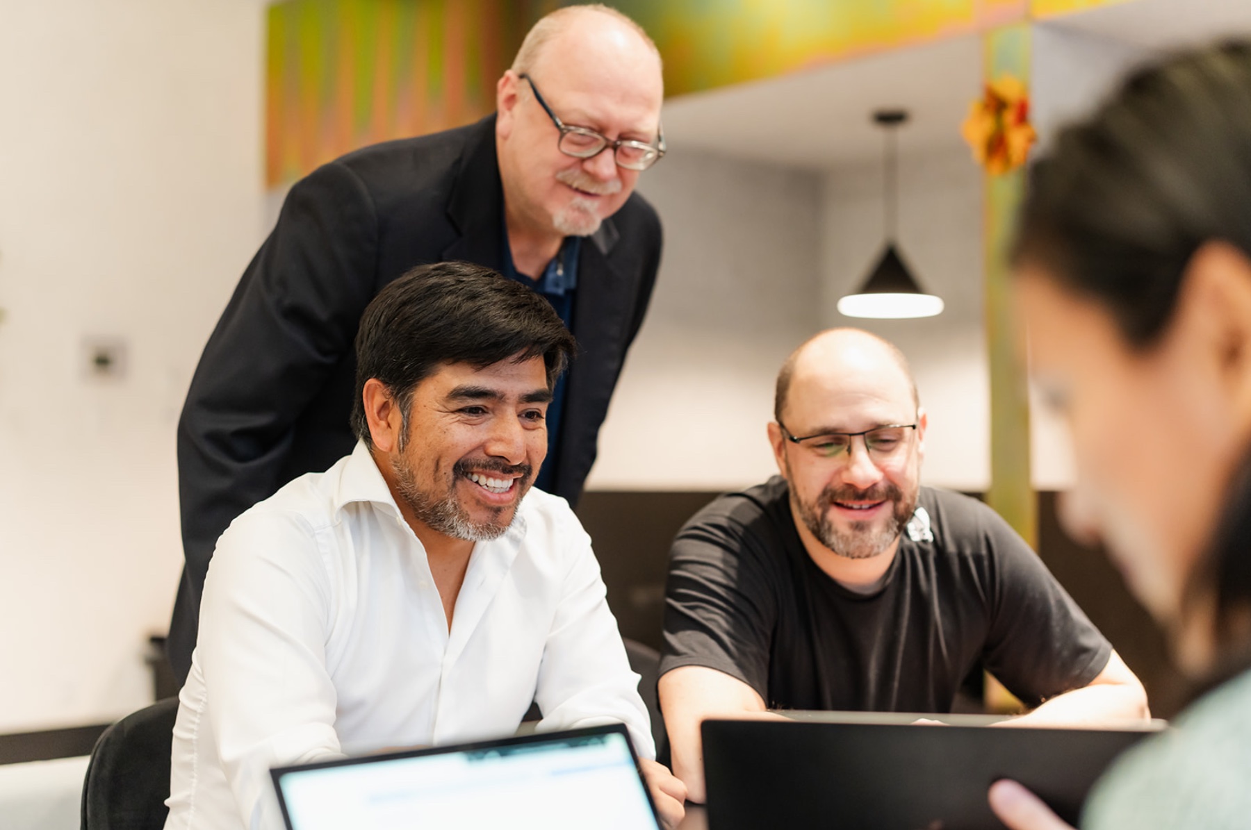Coloso colleagues collaborating around a table